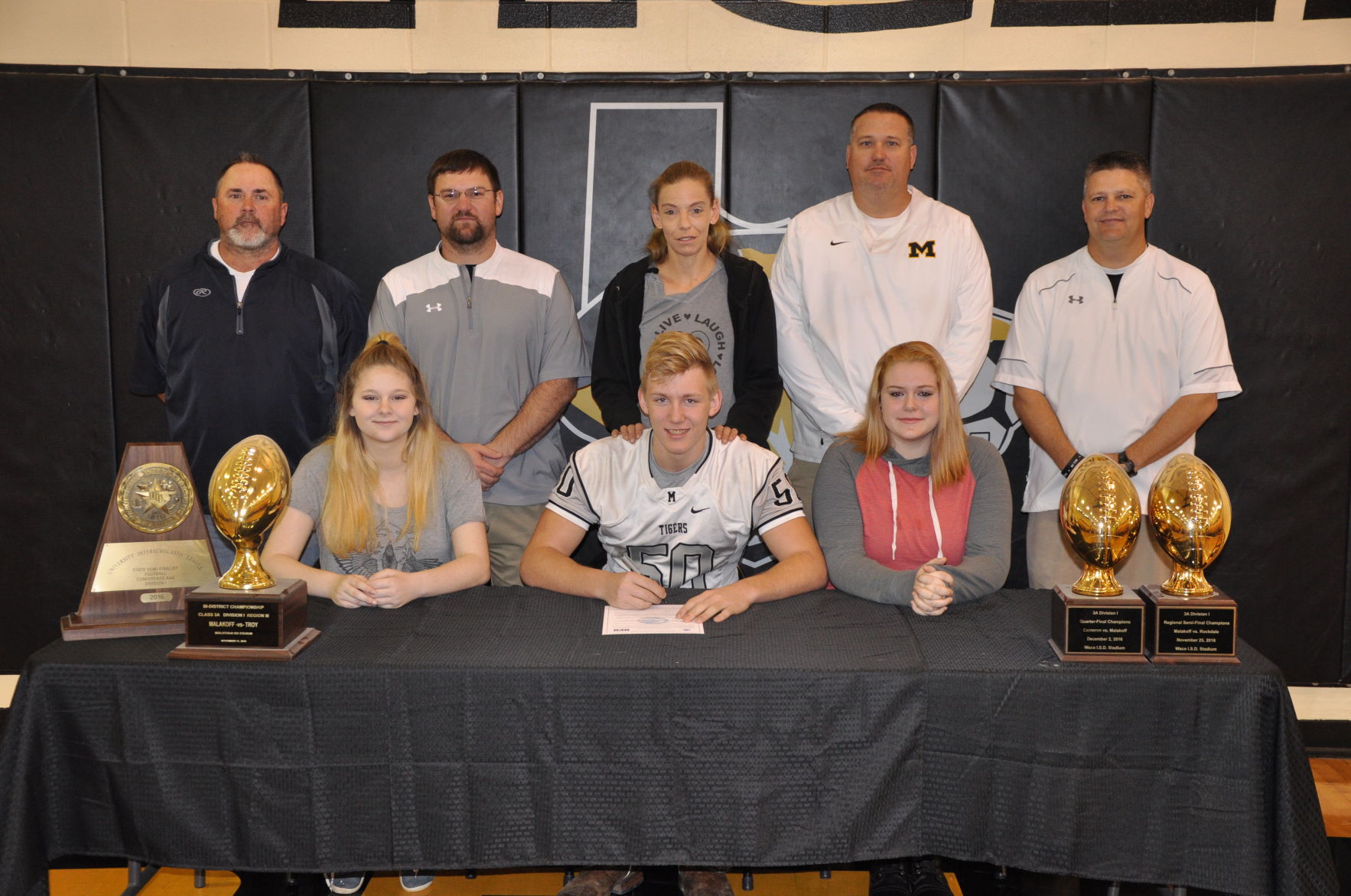 Coker signing